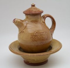 tan brown Terracotta Oil Jar on Plate by Mary Briggs